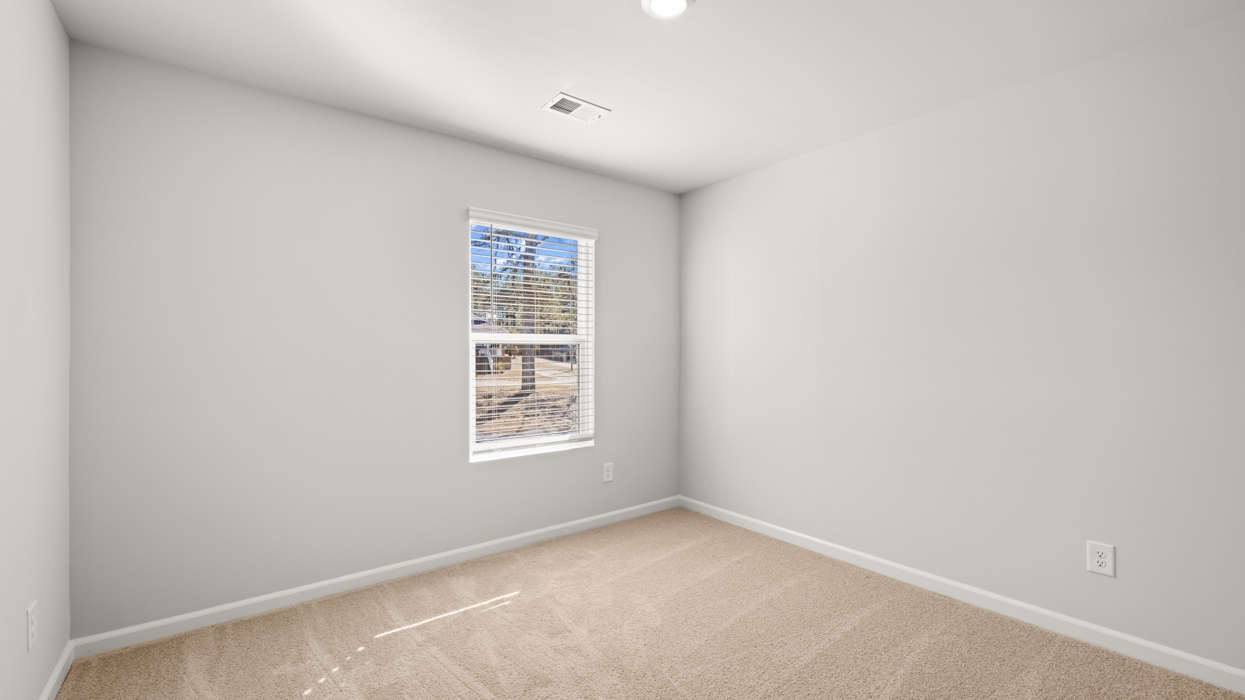 bedroom with single window and closet