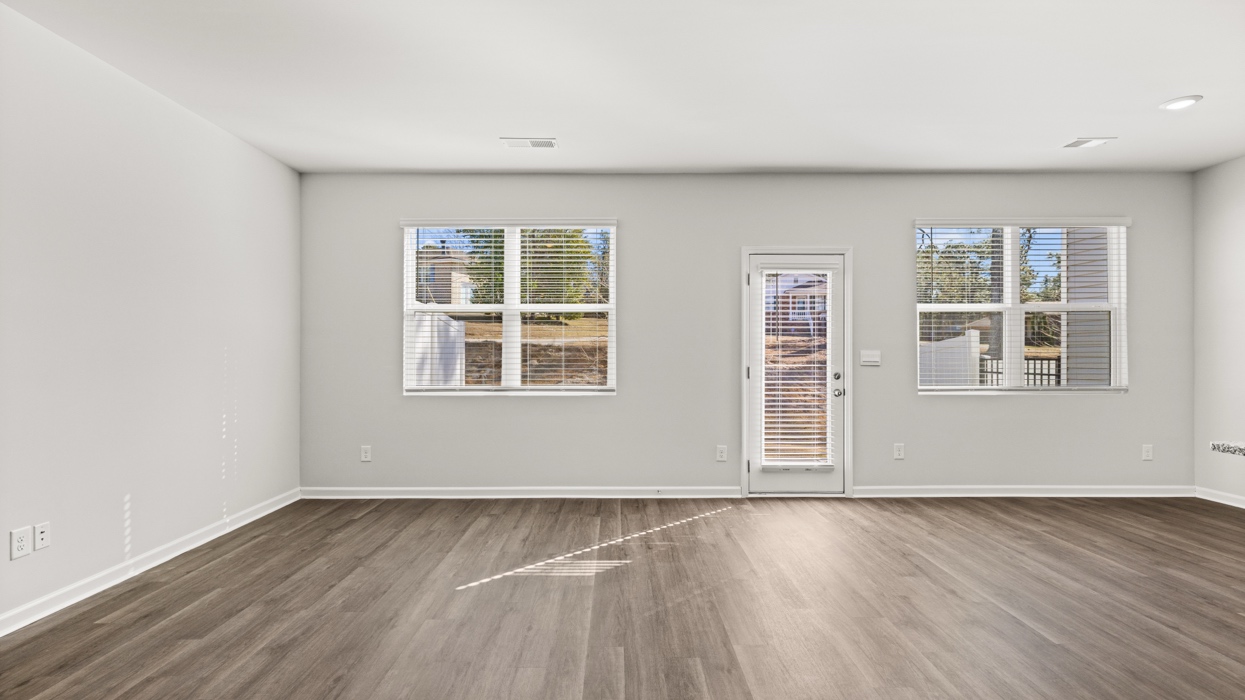 open concept living area with double windows
