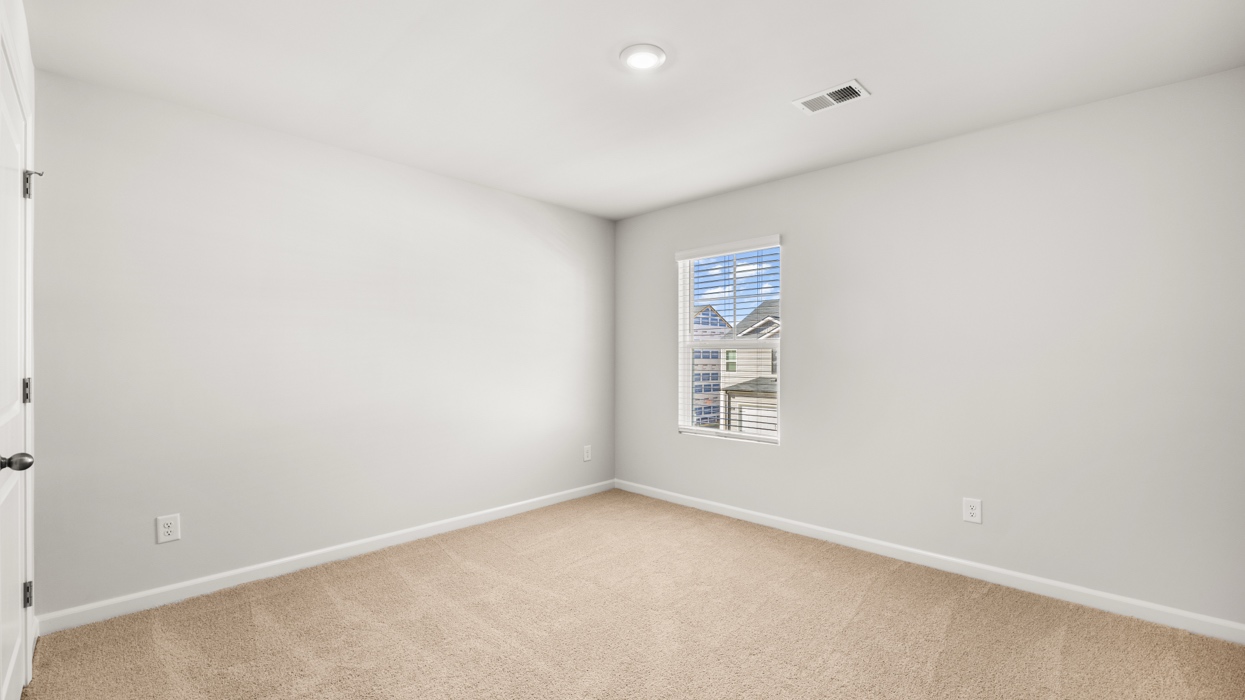bedroom with single window and closet