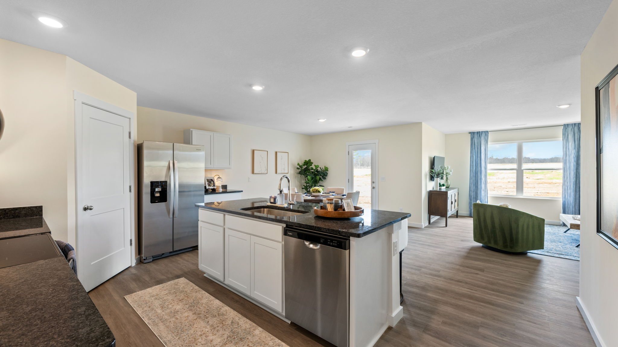 open concept kitchen with large island and stainless steel appliances