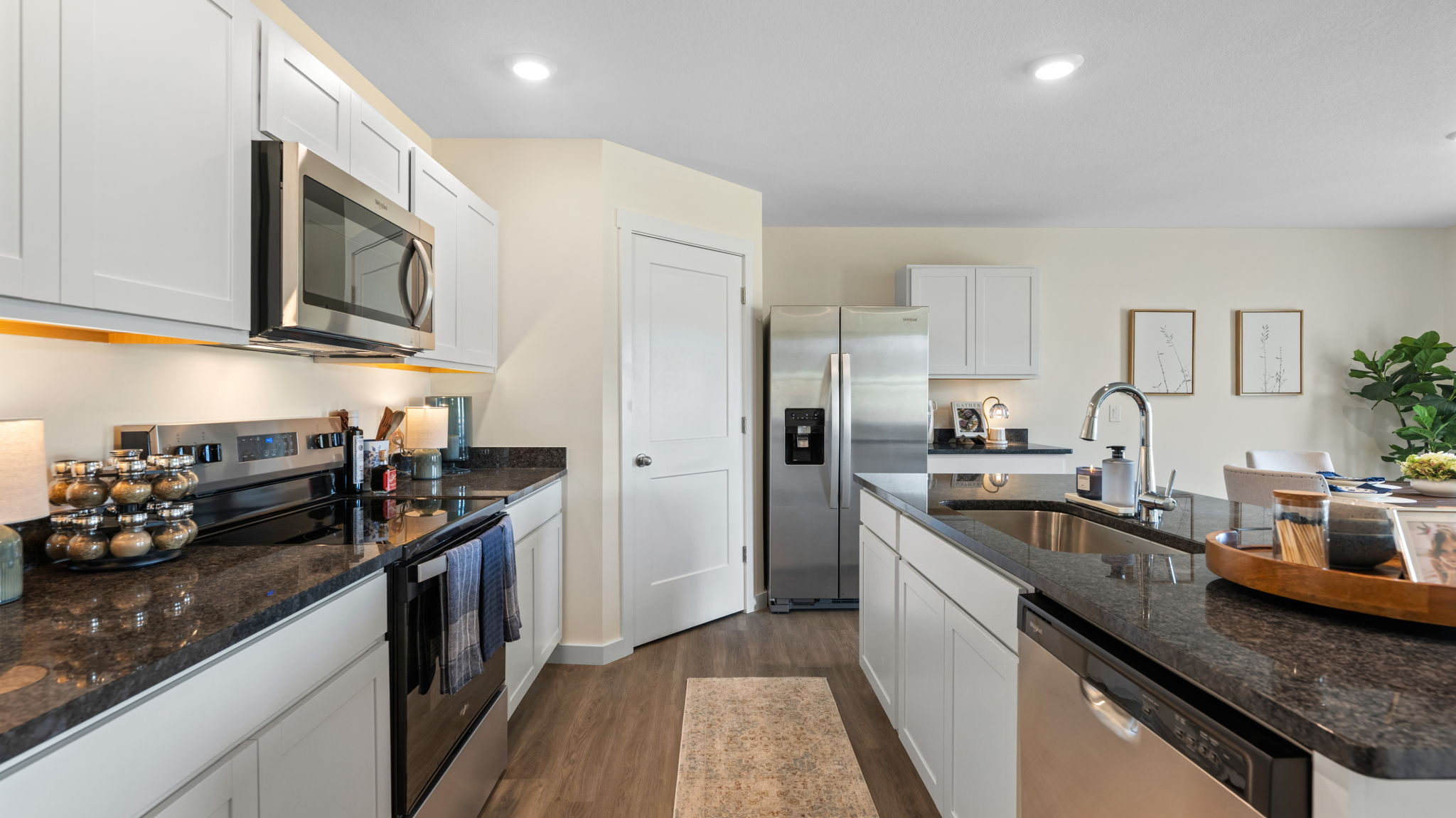 open concept kitchen with large island and stainless steel appliances