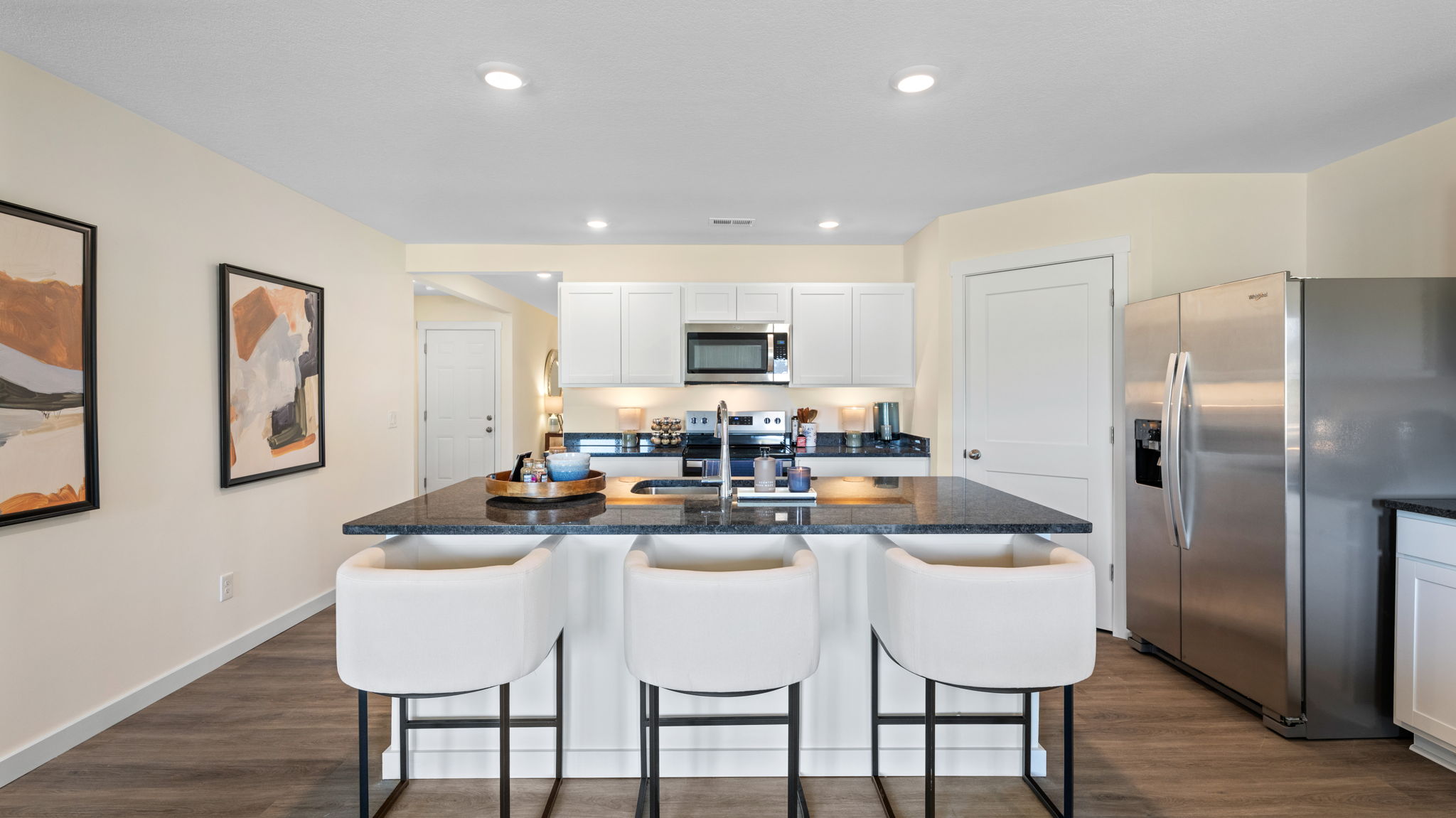 open concept kitchen with large island and stainless steel appliances
