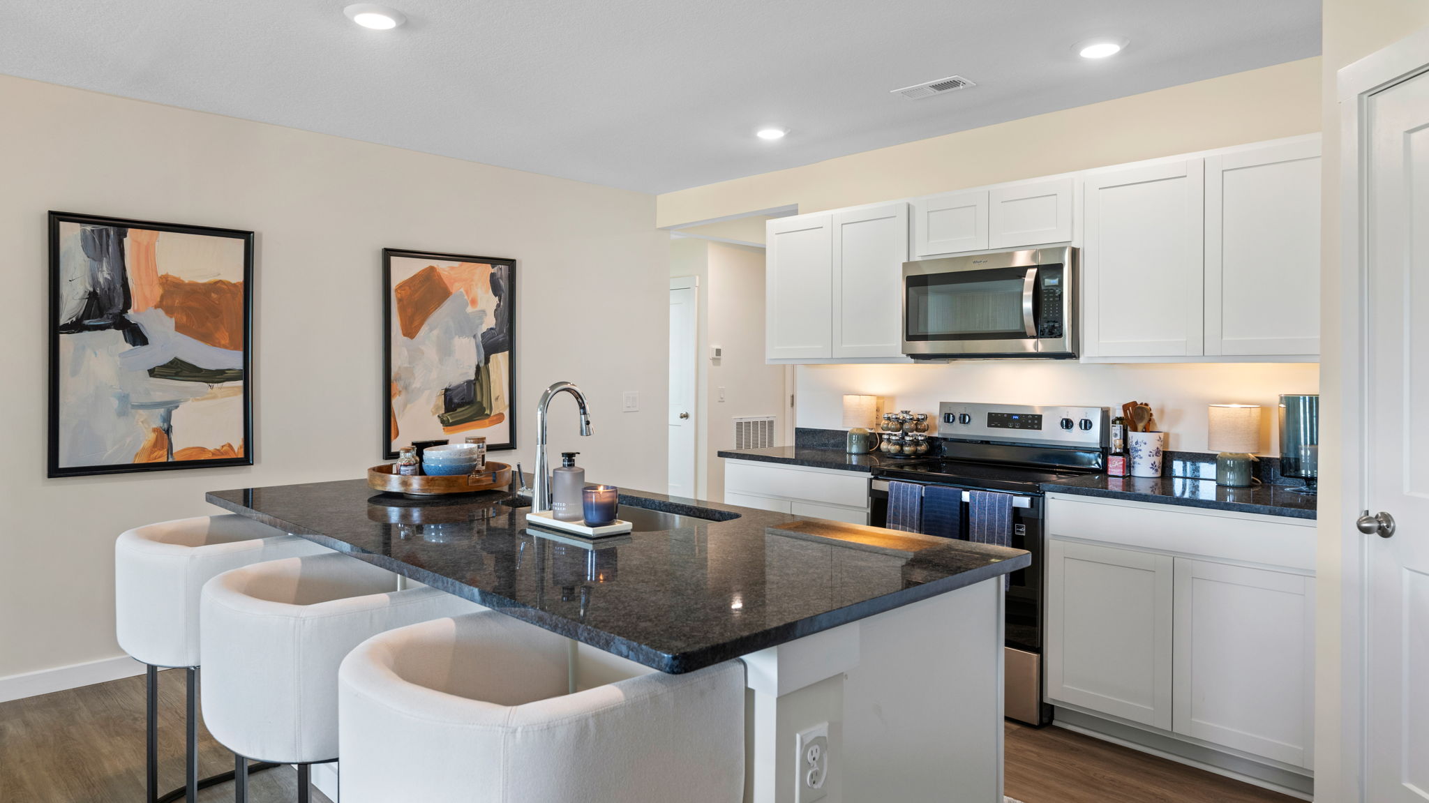 open concept kitchen with large island and stainless steel appliances