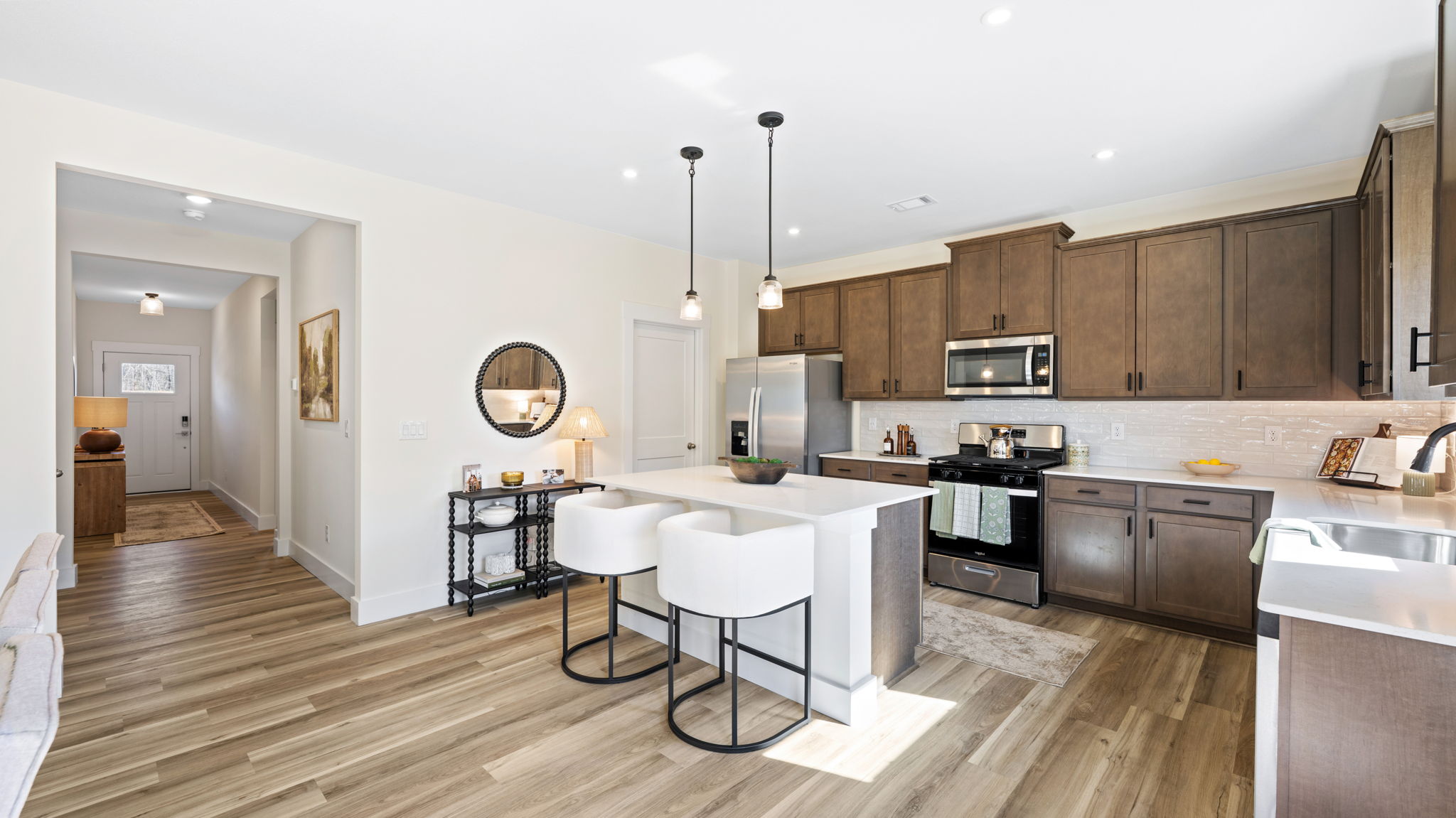 open concept kitchen with large island and stainless steel appliances