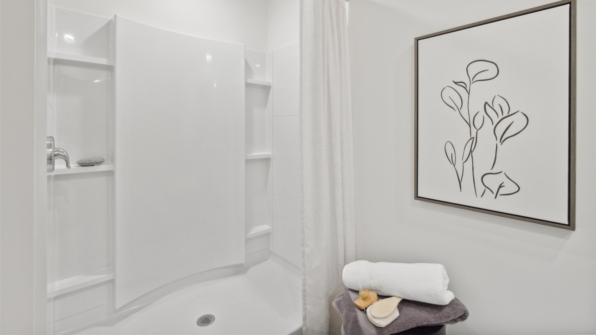 Primary bathroom with luxurious shower and built in storage