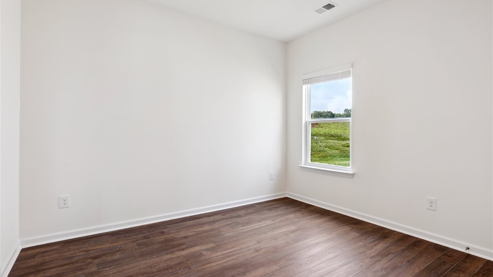 Bedroom with ample natural light and carpet floors