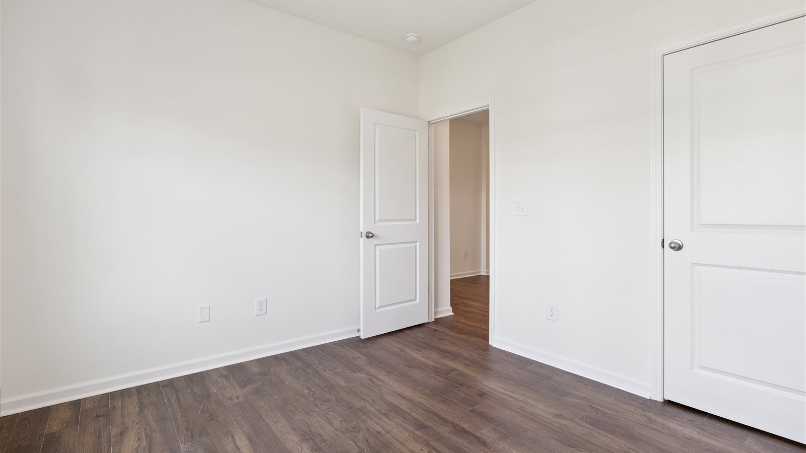 Bedroom with ample natural light and carpet floors