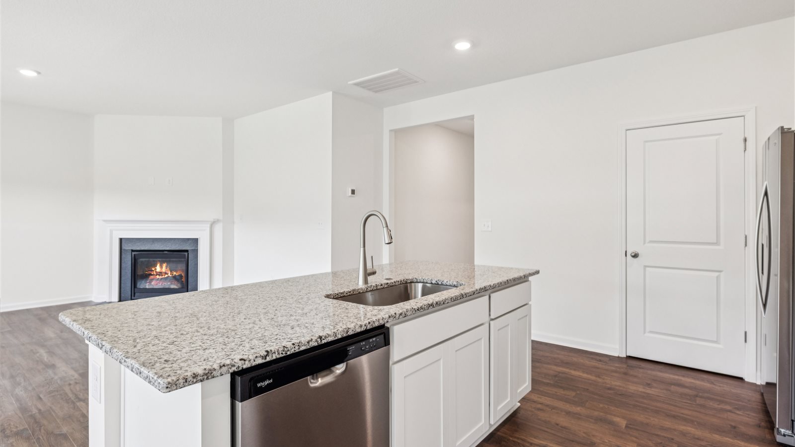 Open concept living, dining, and kitchen space