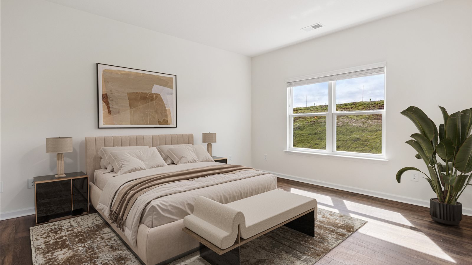 Primary bedroom with private attached bathroom and walk-in closet