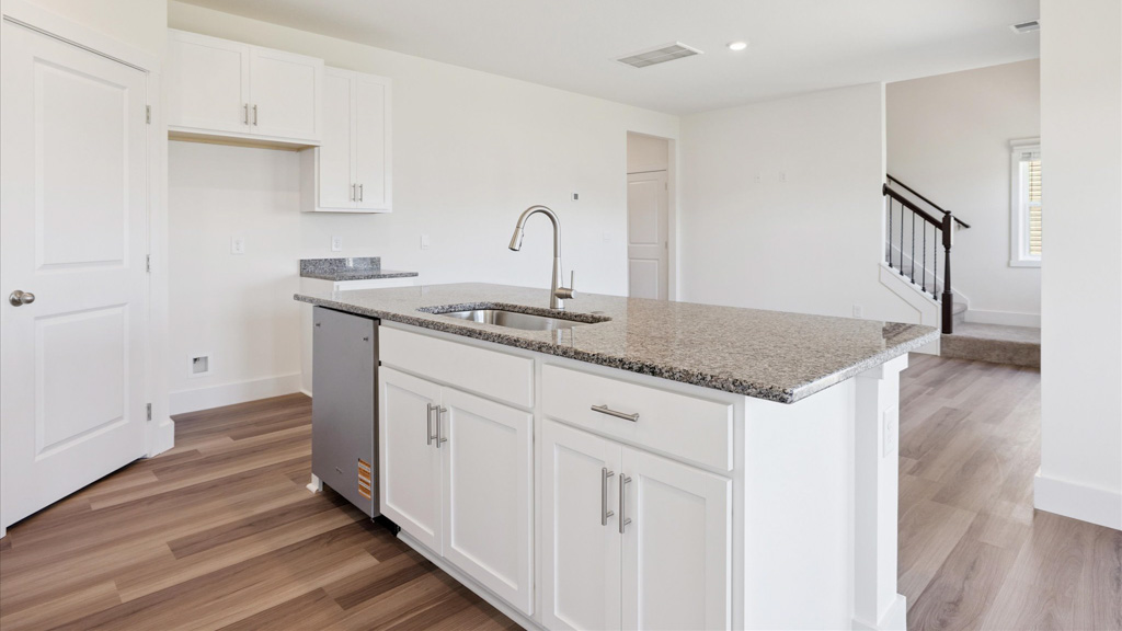 Spacious open concept kitchen with island and counter prep space
