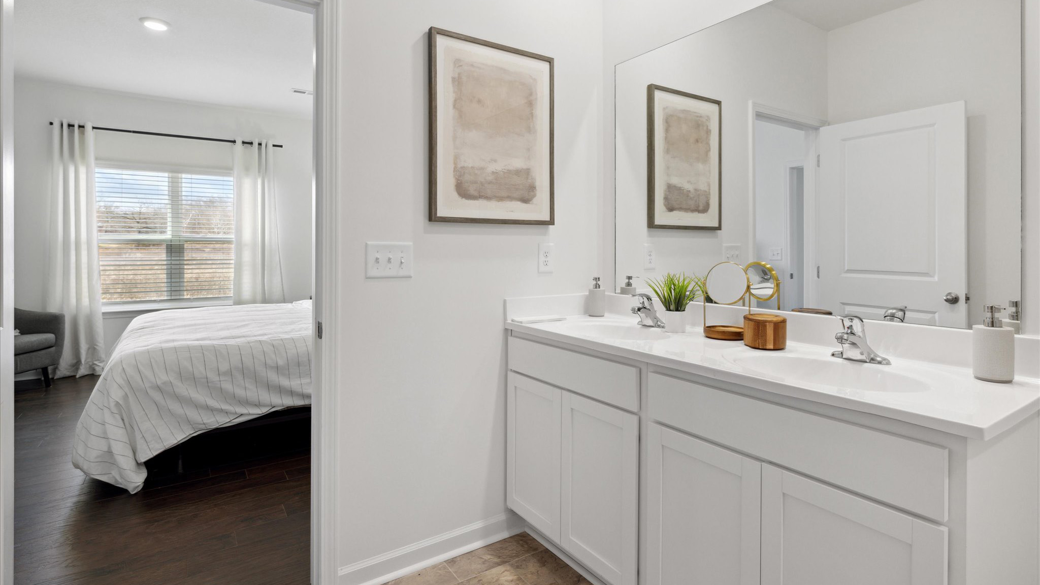 Primary bathroom with double vanity and walk-in shower