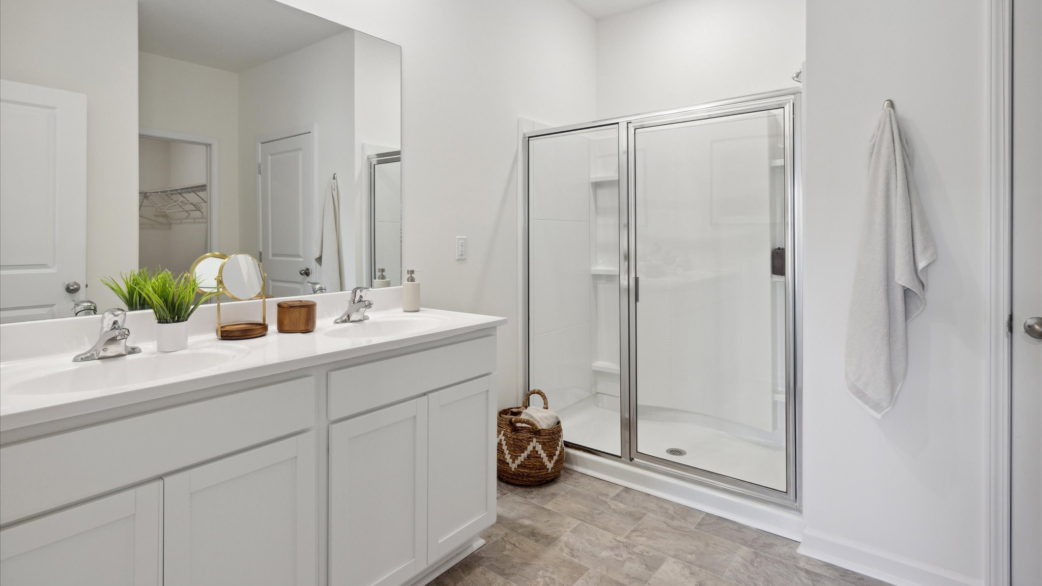 Primary bedroom with private attached bathroom and walk-in closet