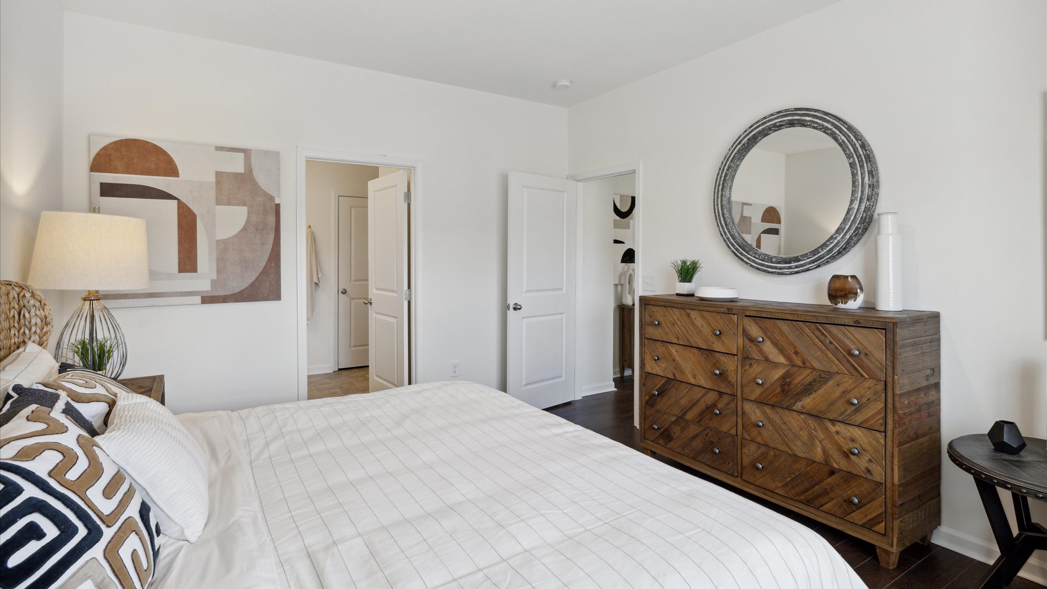 primary suite with private bathroom and walk-in closet