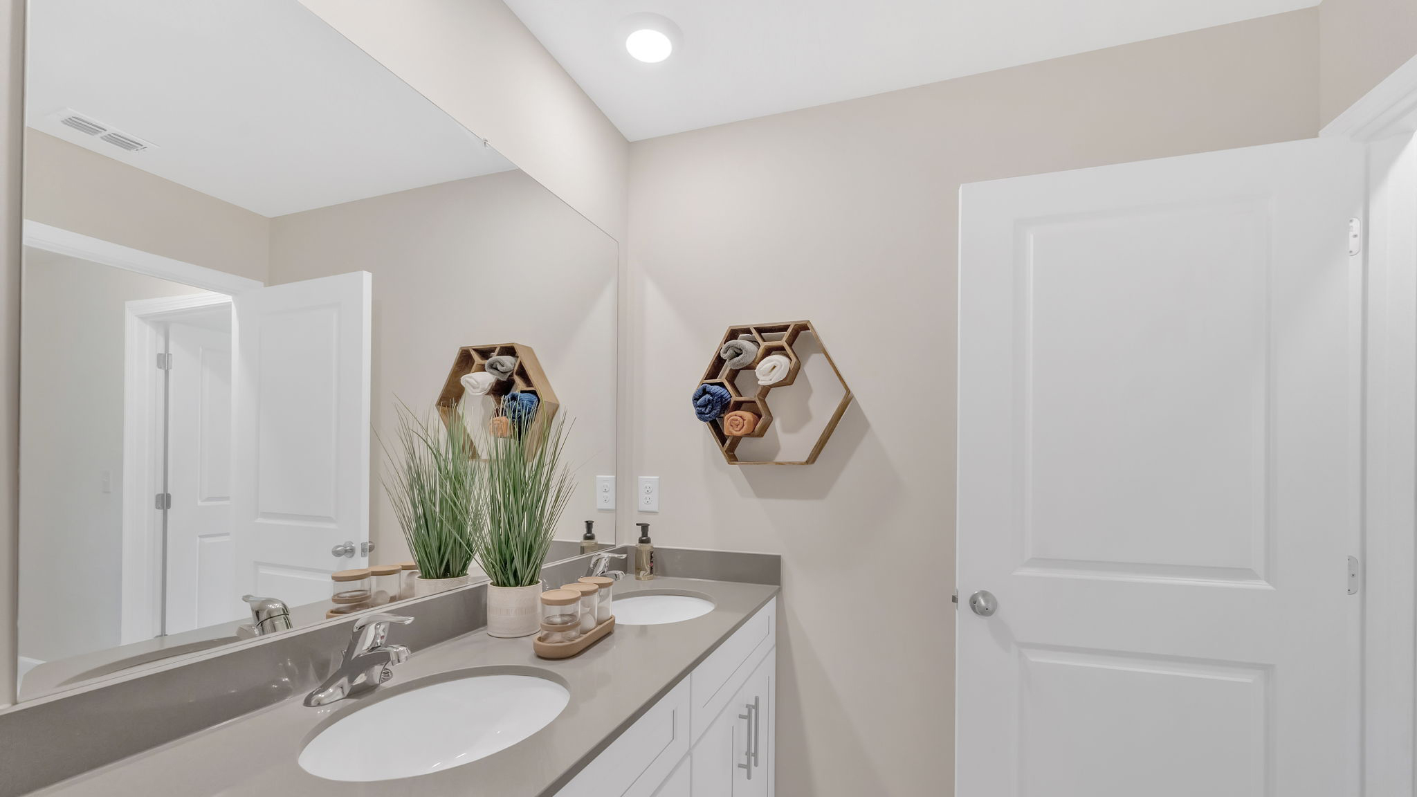 Guest bathroom with built in vanity and combination bathtub shower