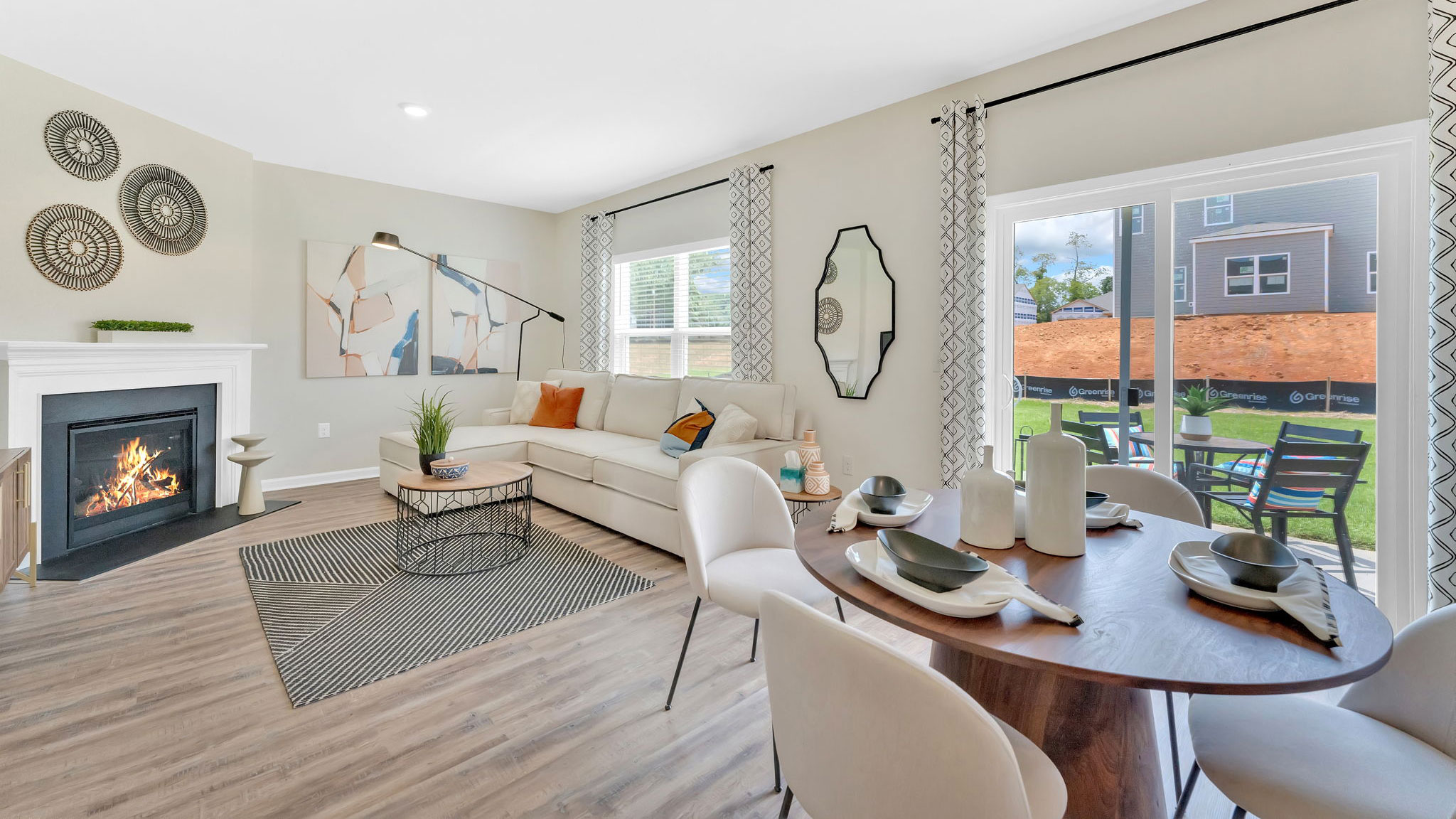 Open concept living, dining, and kitchen space