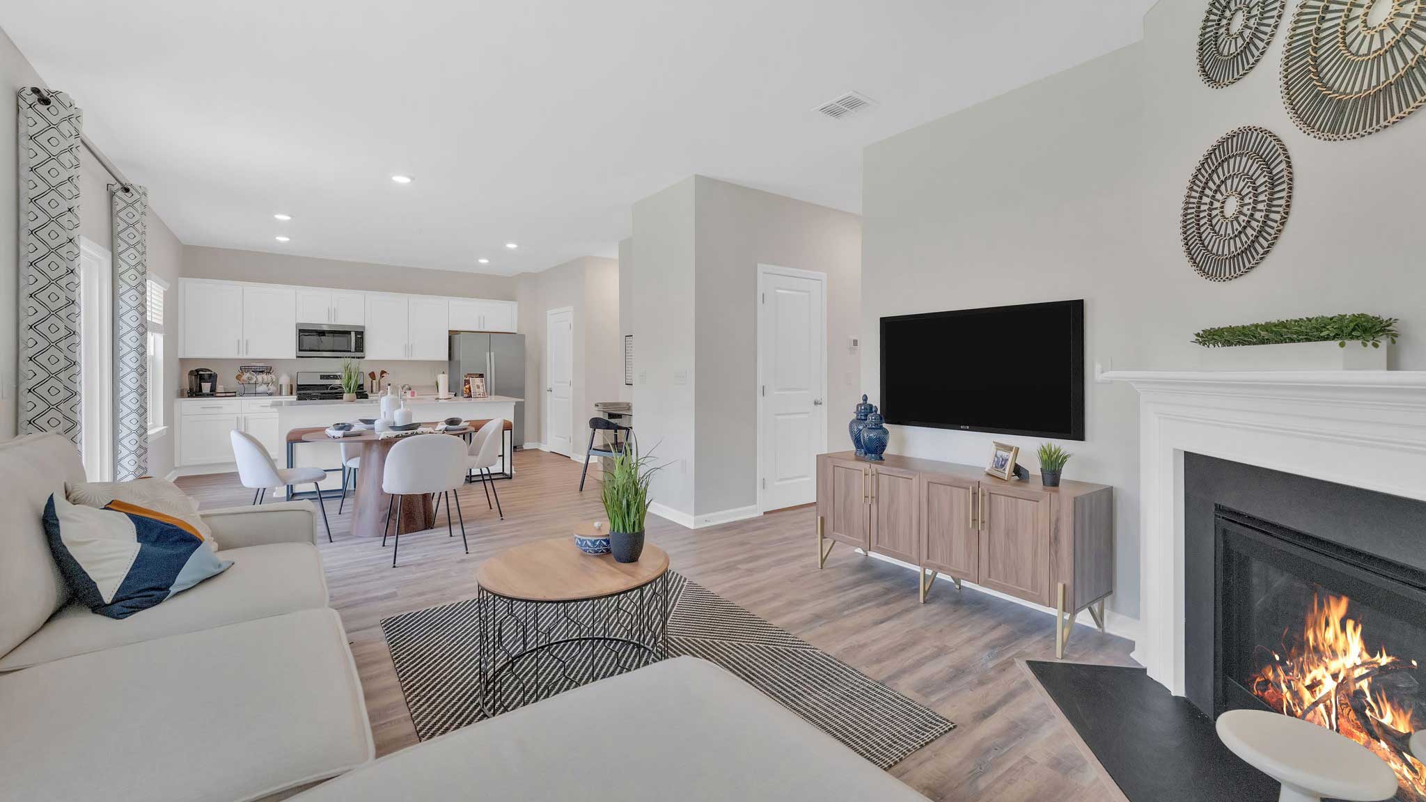 Open concept living, dining, and kitchen space