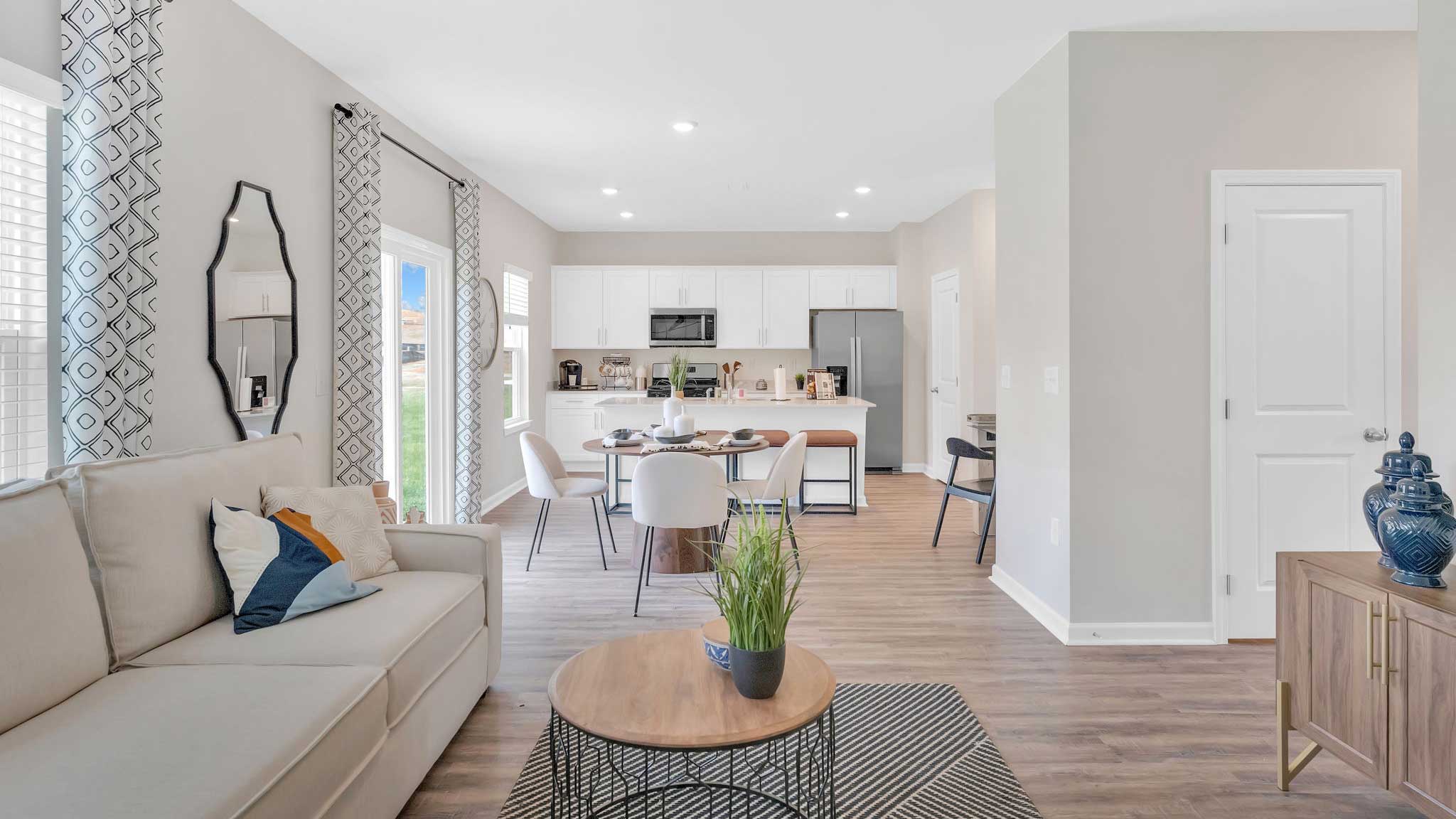 Open concept living, dining, and kitchen space