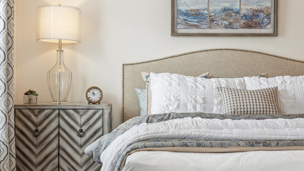 Primary bedroom with private attached bathroom and walk-in closet