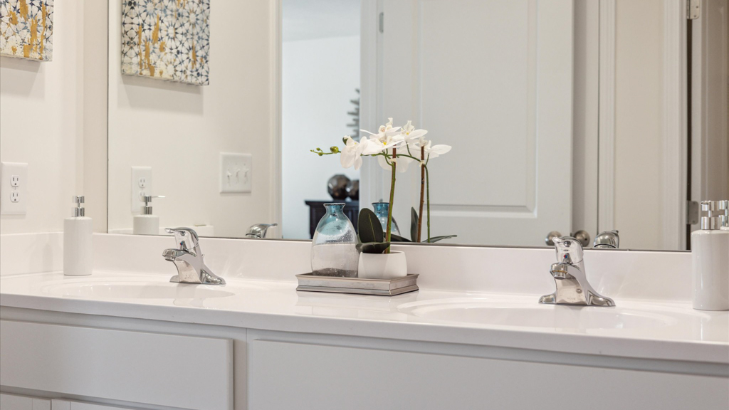 Primary bathroom with double vanity and walk-in shower