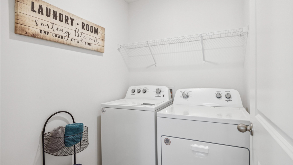 Laundry room and utility closet space with extra storage