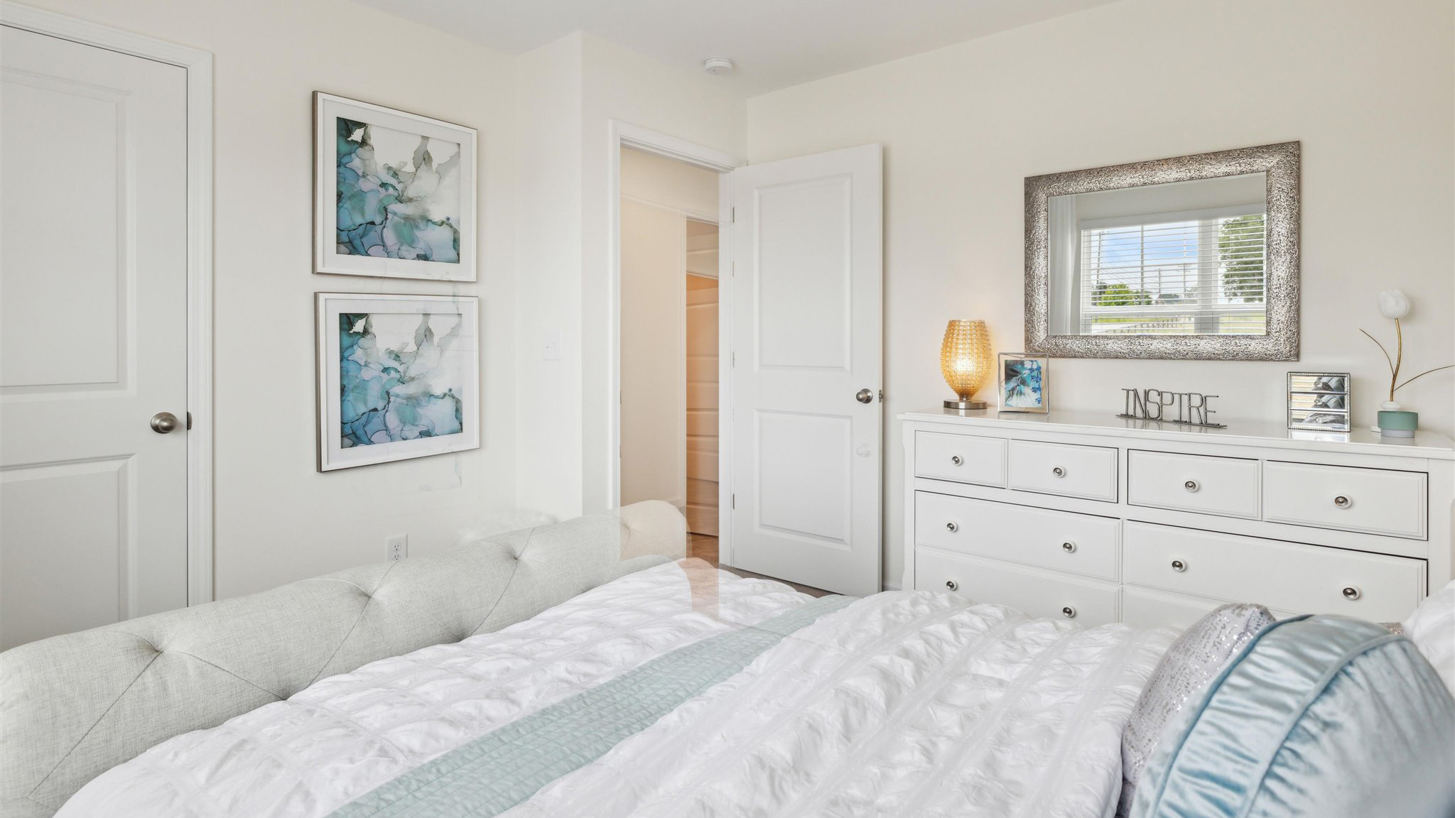 Bedroom with ample natural light and carpet floors