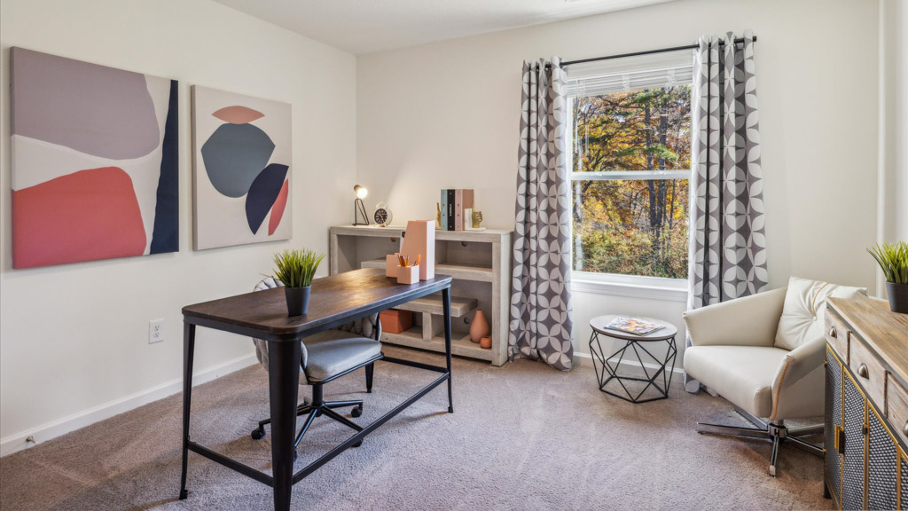 Bedroom with ample natural light and carpet floors