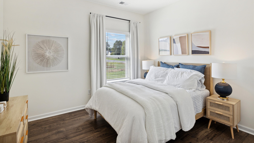 Bedroom with ample natural light and carpet floors