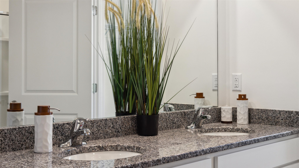 Primary bathroom with double vanity and walk-in shower