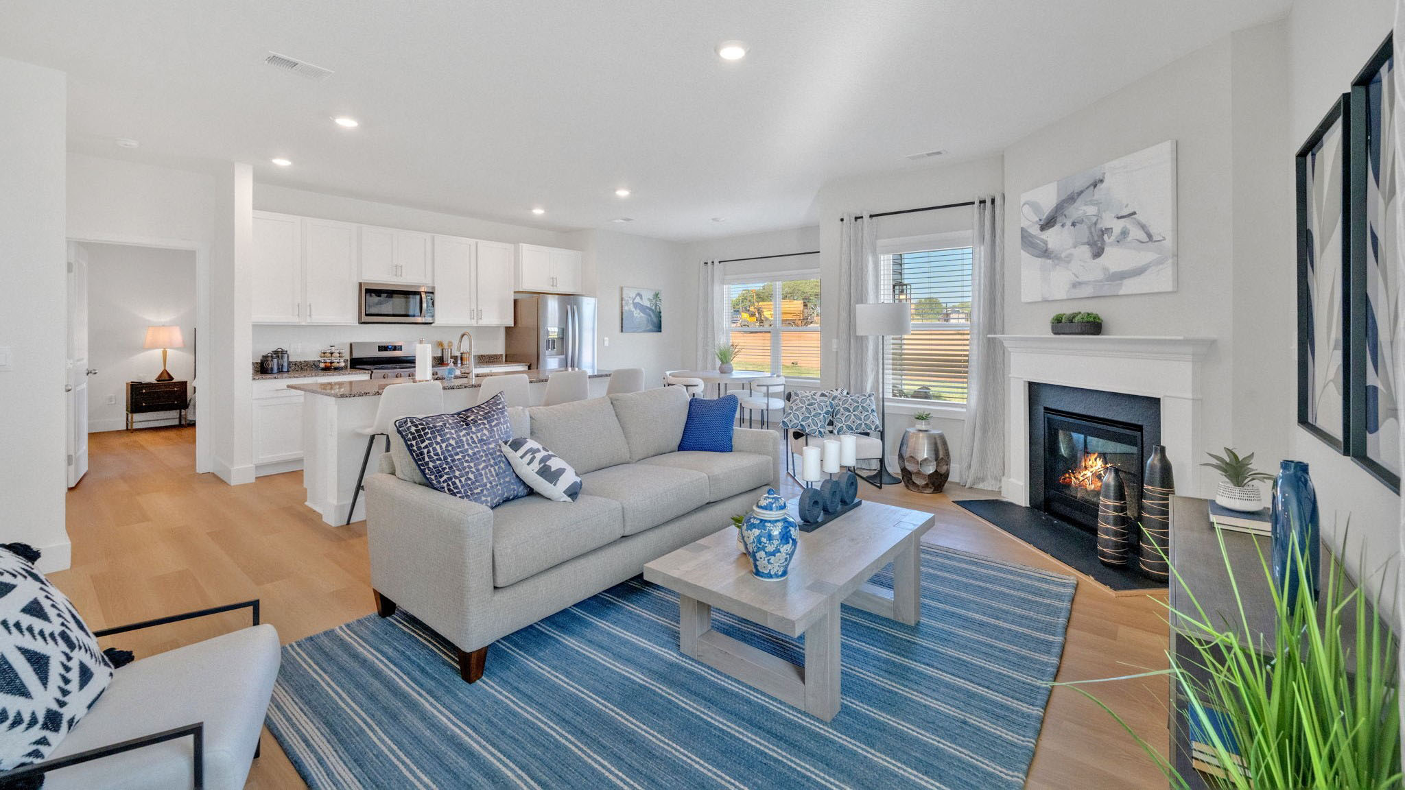 Spacious living and great  room space with light allowing windows