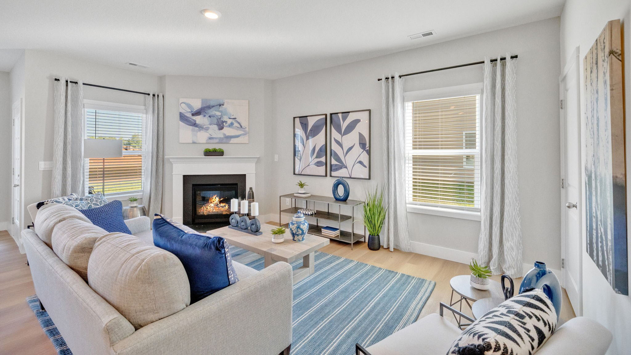 Spacious living and great  room space with light allowing windows