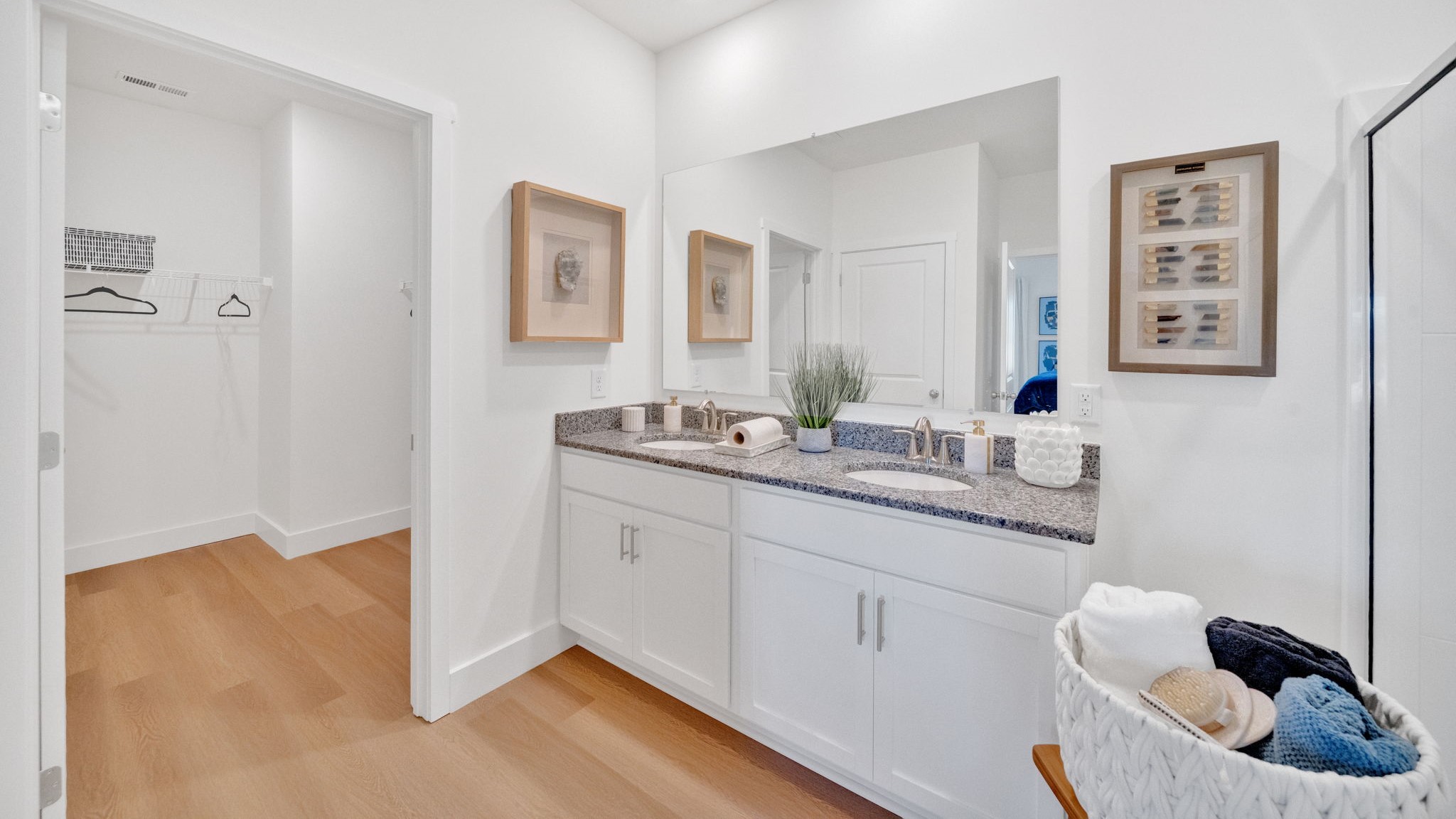 Primary bathroom with double vanity and walk-in shower