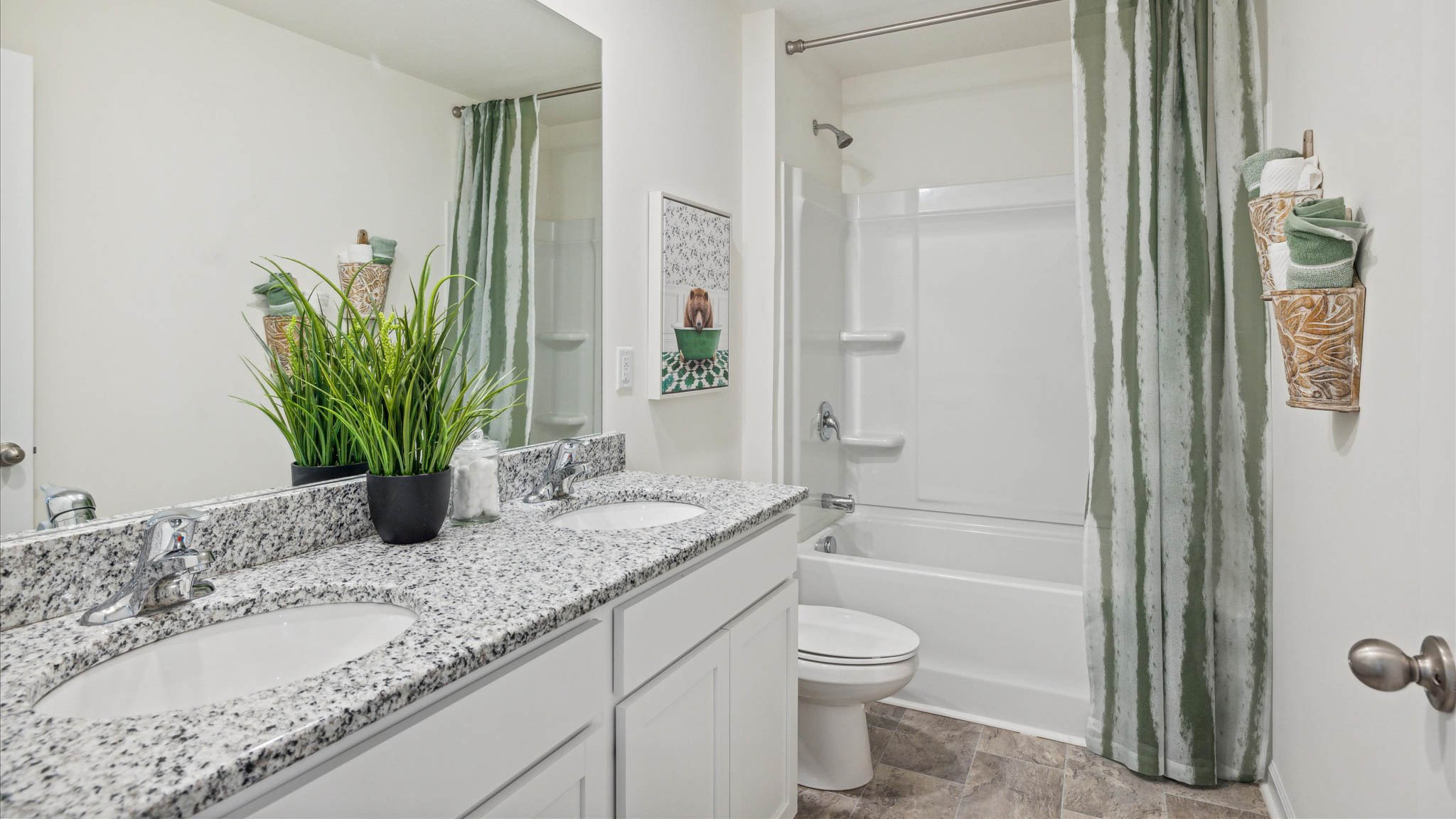 Guest bathroom with built in vanity and combination bathtub shower