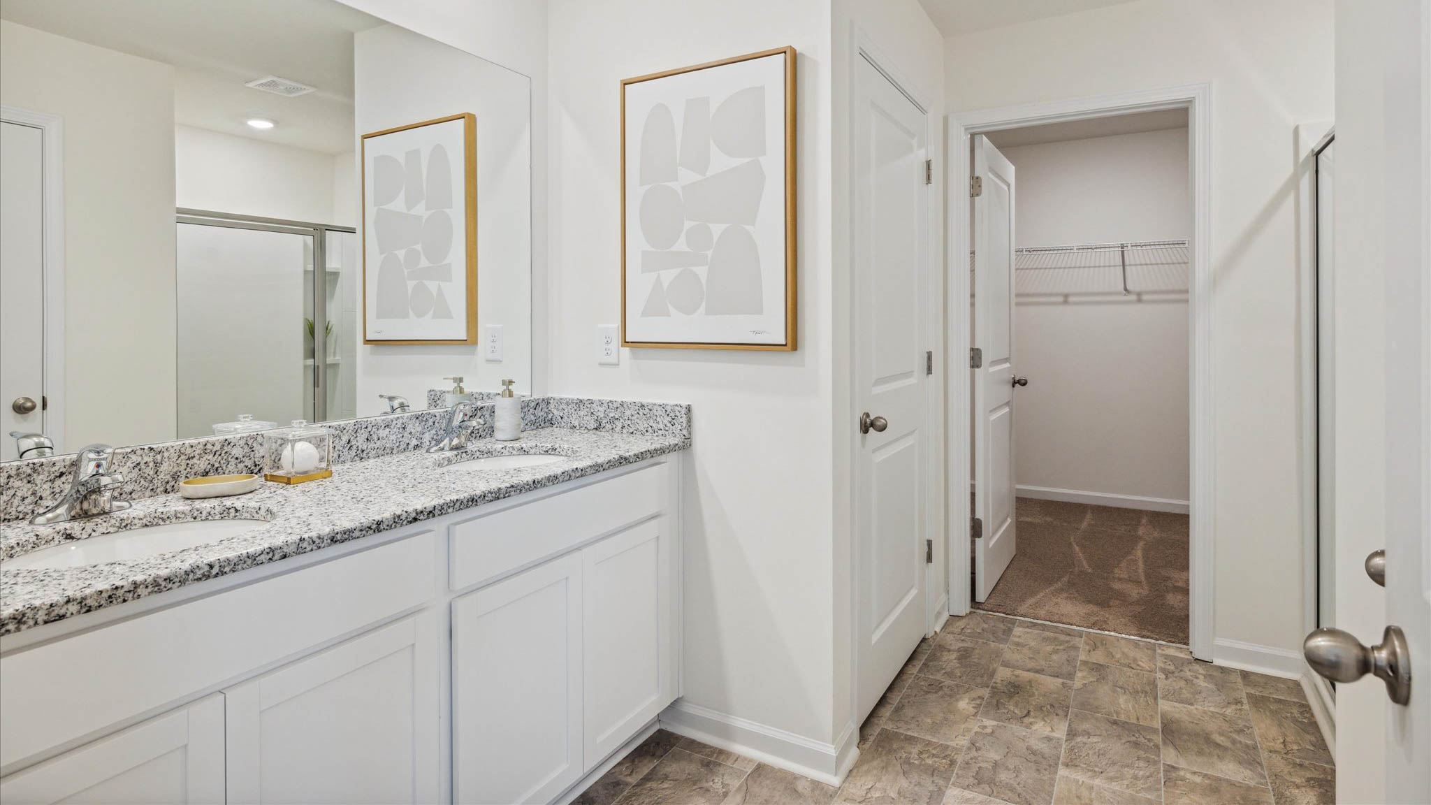 Private attached primary bathroom with built in vanity