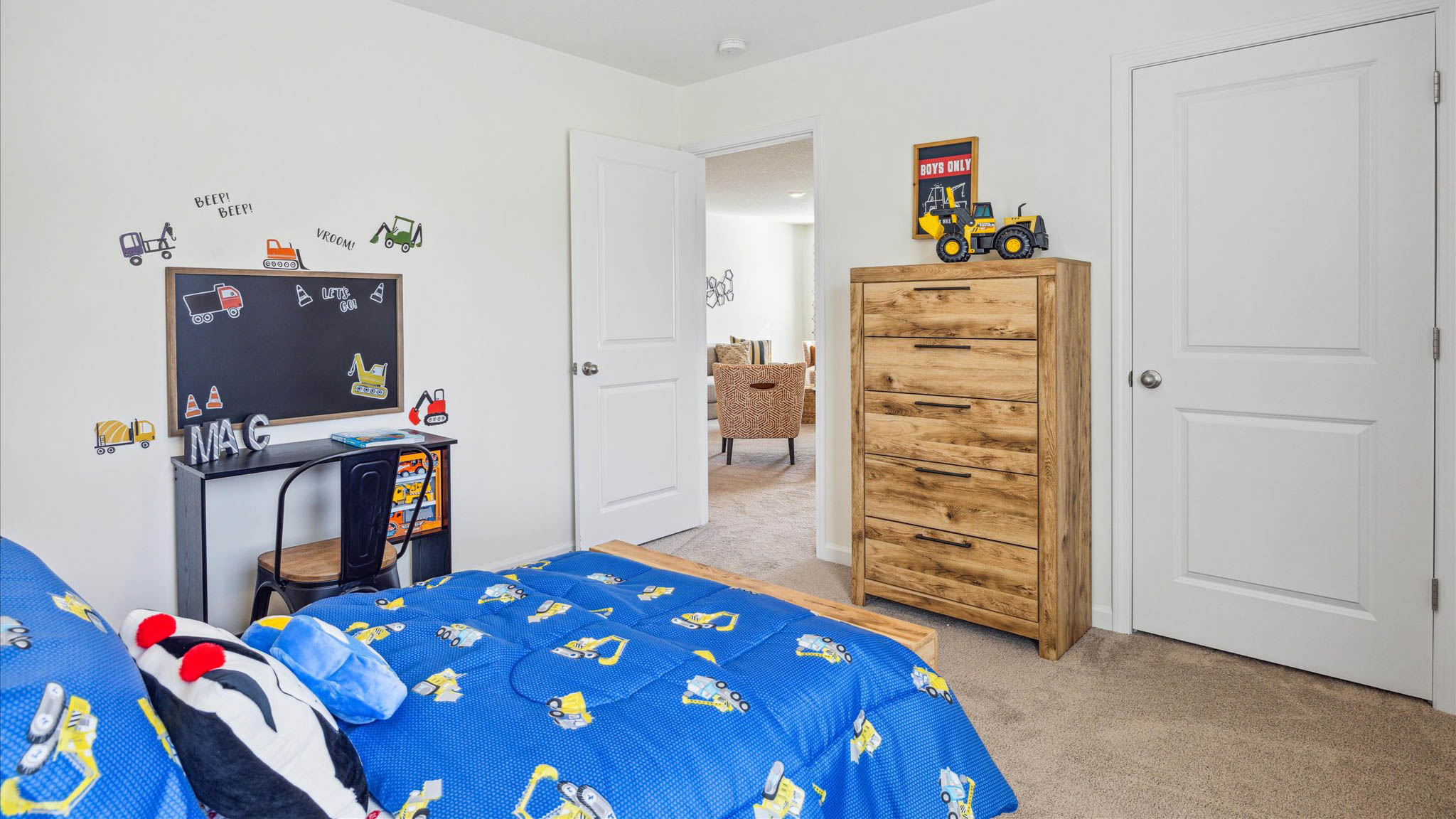 Bedroom with ample natural light and plush carpet floors