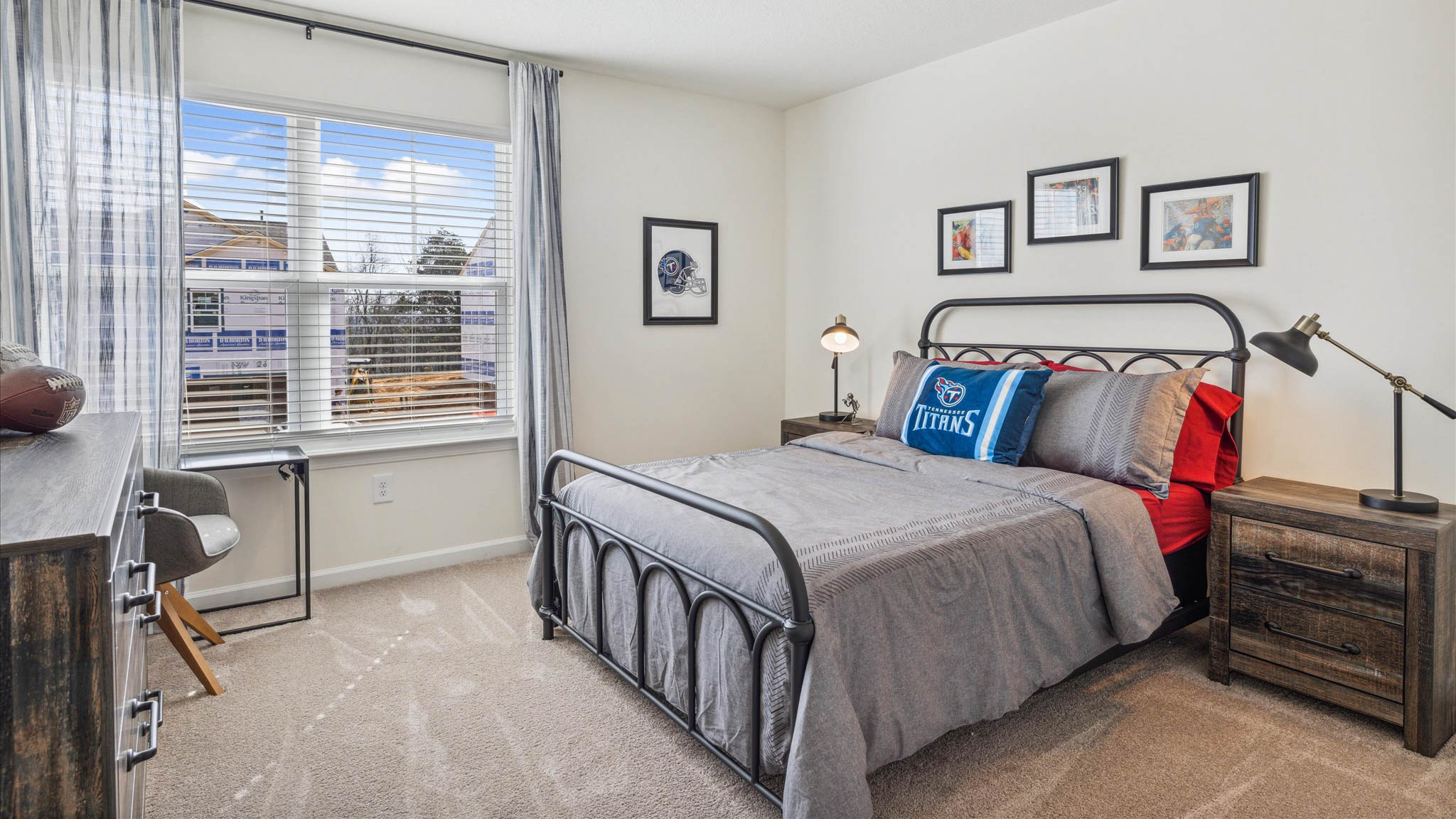 Bedroom with ample natural light and plush carpet floors