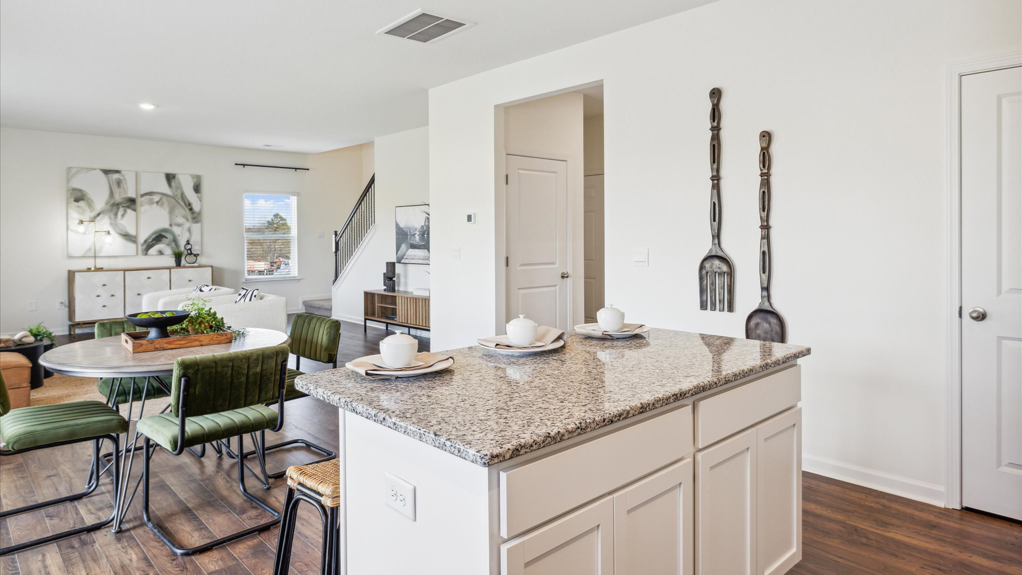 Open concept living, dining, and kitchen space