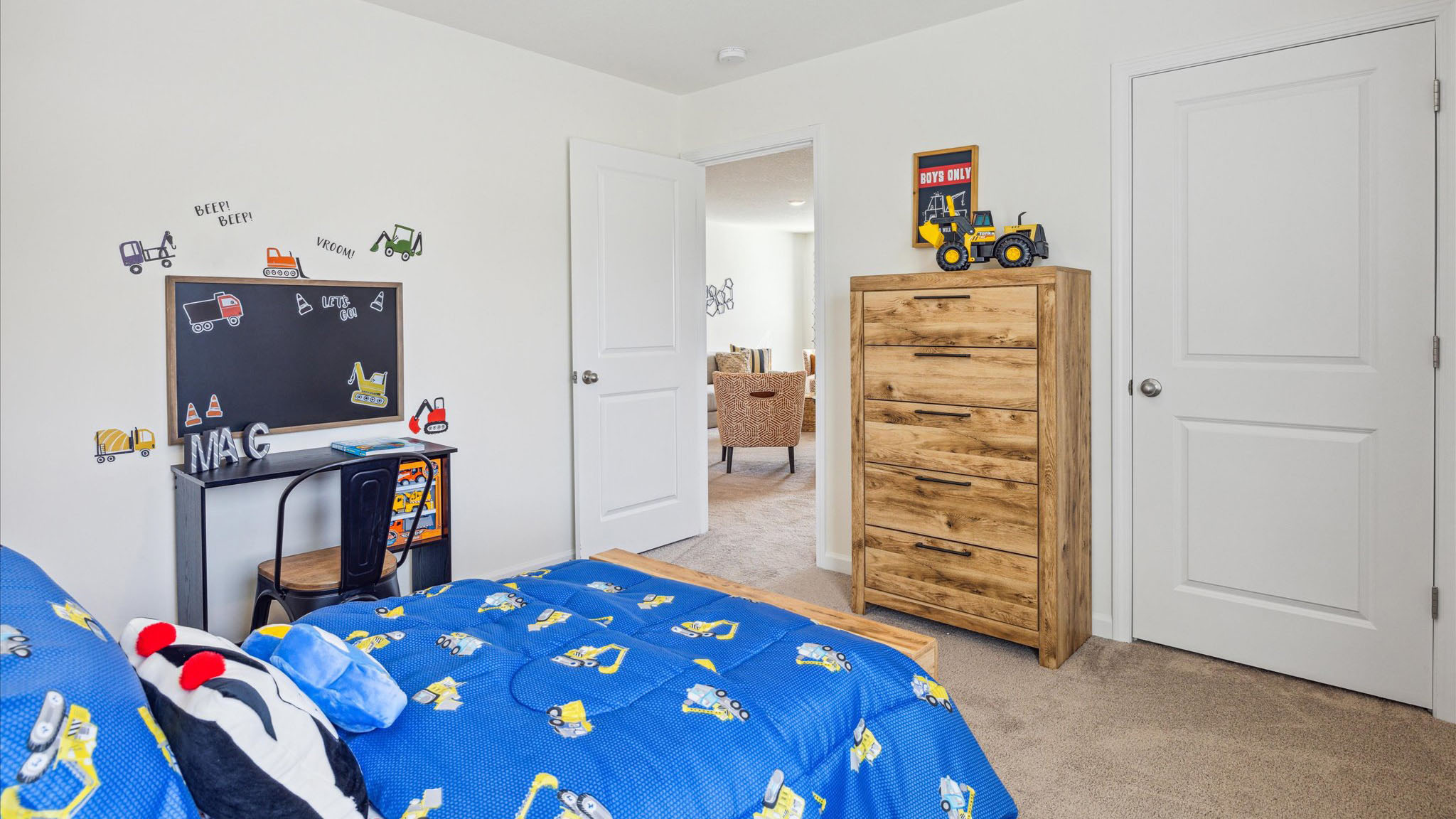 Bedroom with ample natural light and carpet floors