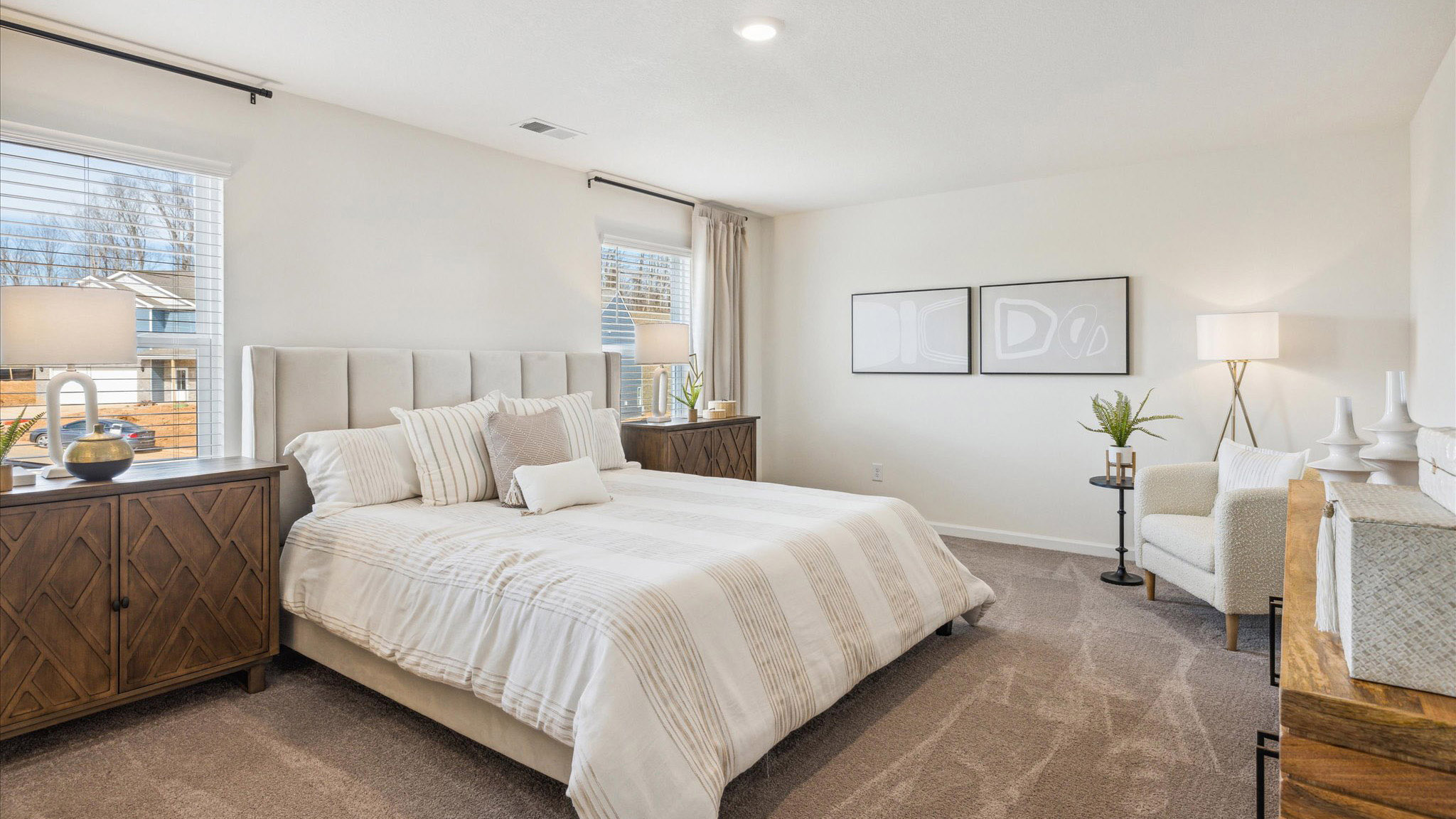 Primary bedroom with private attached bathroom and walk-in closet