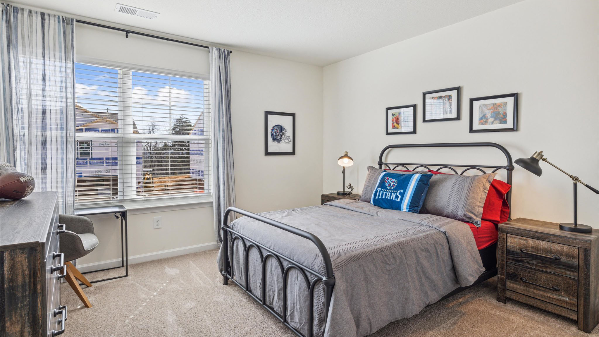 Bedroom with ample natural light and carpet floors