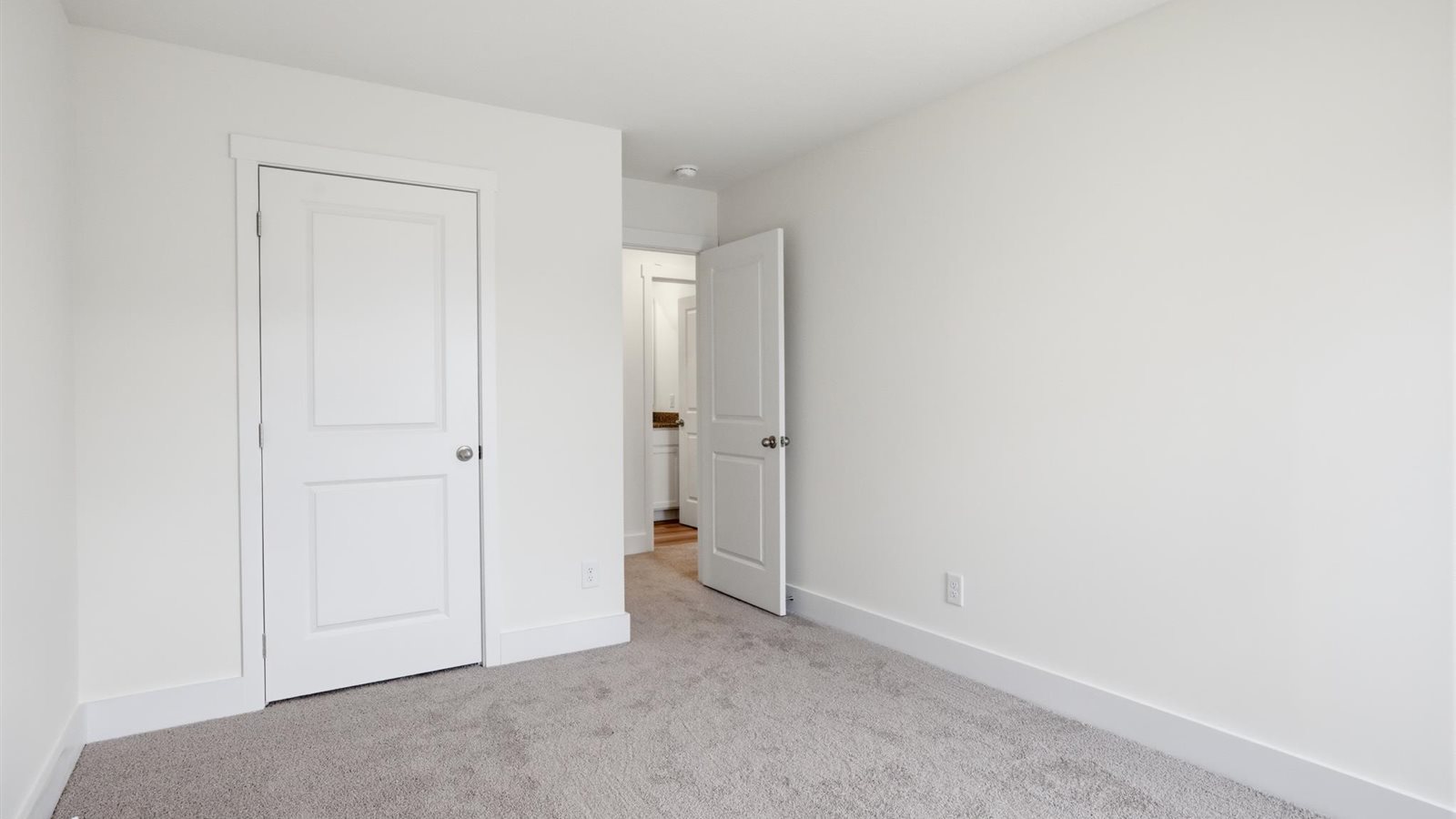 Bedroom with ample natural light and carpet floors