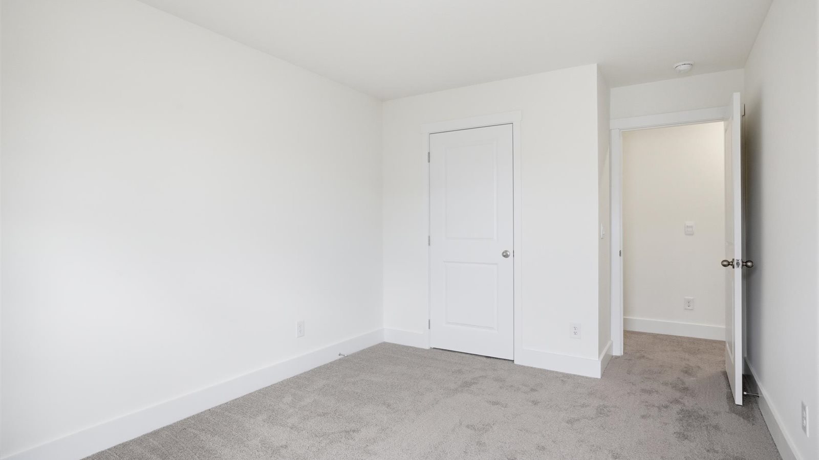 Bedroom with ample natural light and carpet floors