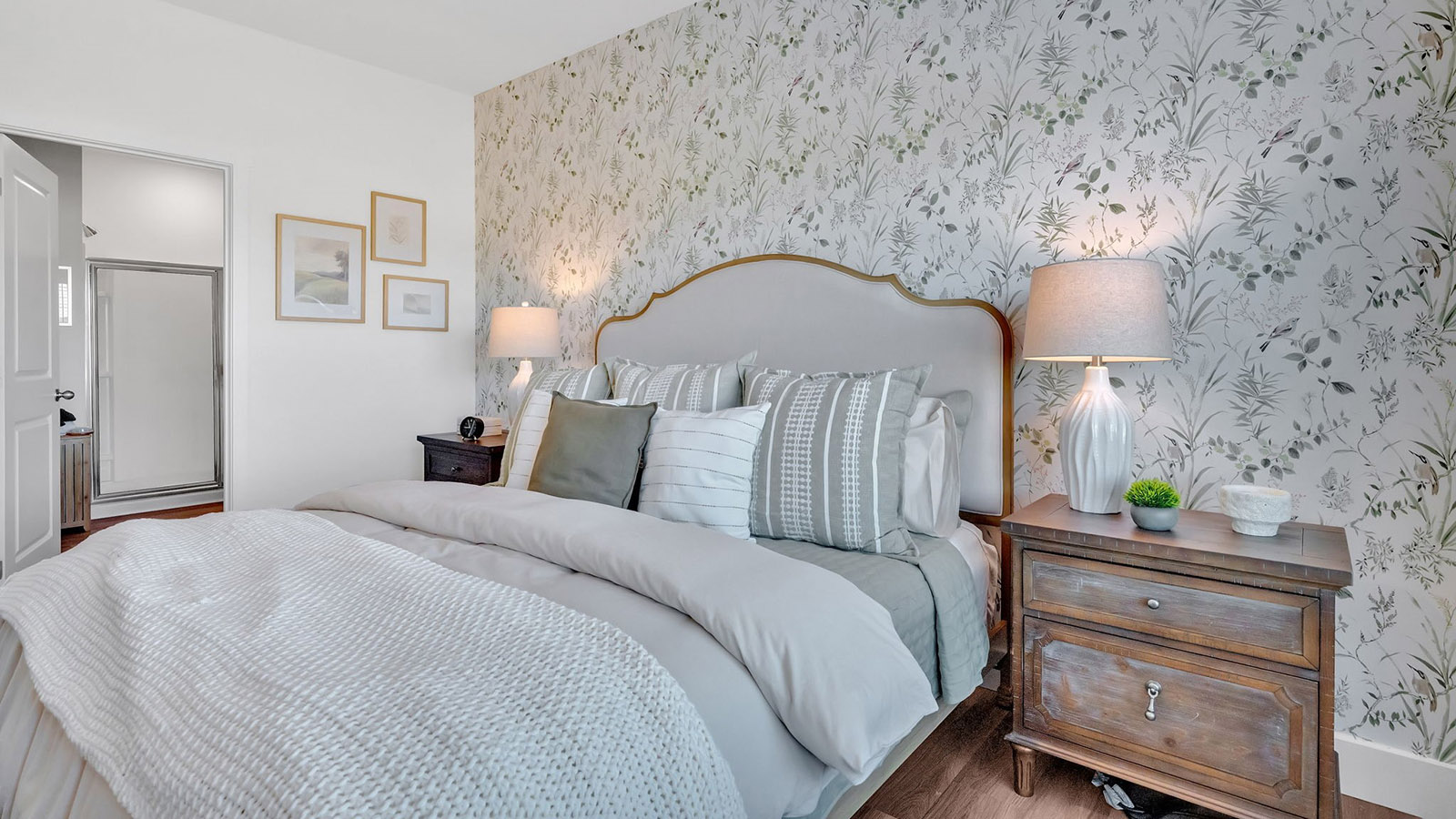 Primary bedroom with private attached bathroom and walk-in closet