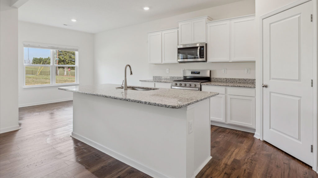 Open concept living, dining, and kitchen space