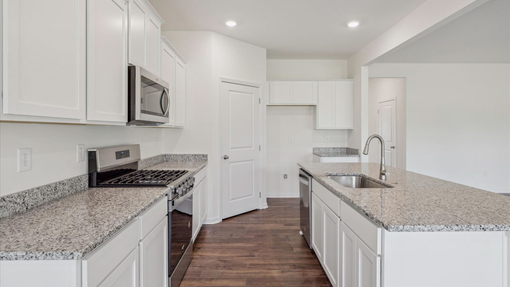 Open concept living, dining, and kitchen space