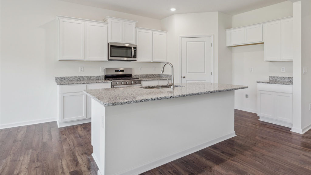 Open concept living, dining, and kitchen space