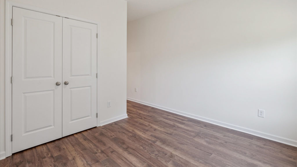 Bedroom with ample natural light and carpet floors
