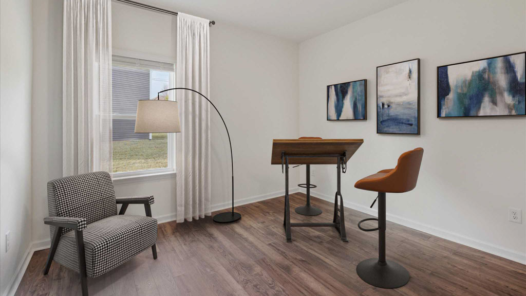 Bedroom with ample natural light and carpet floors