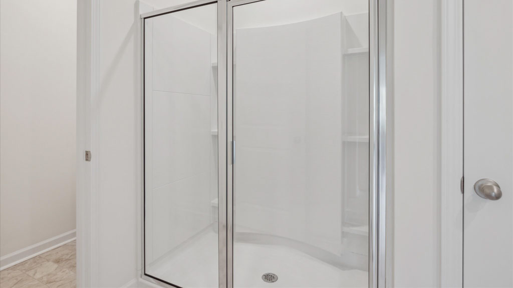 Primary bathroom with double vanity and walk-in shower
