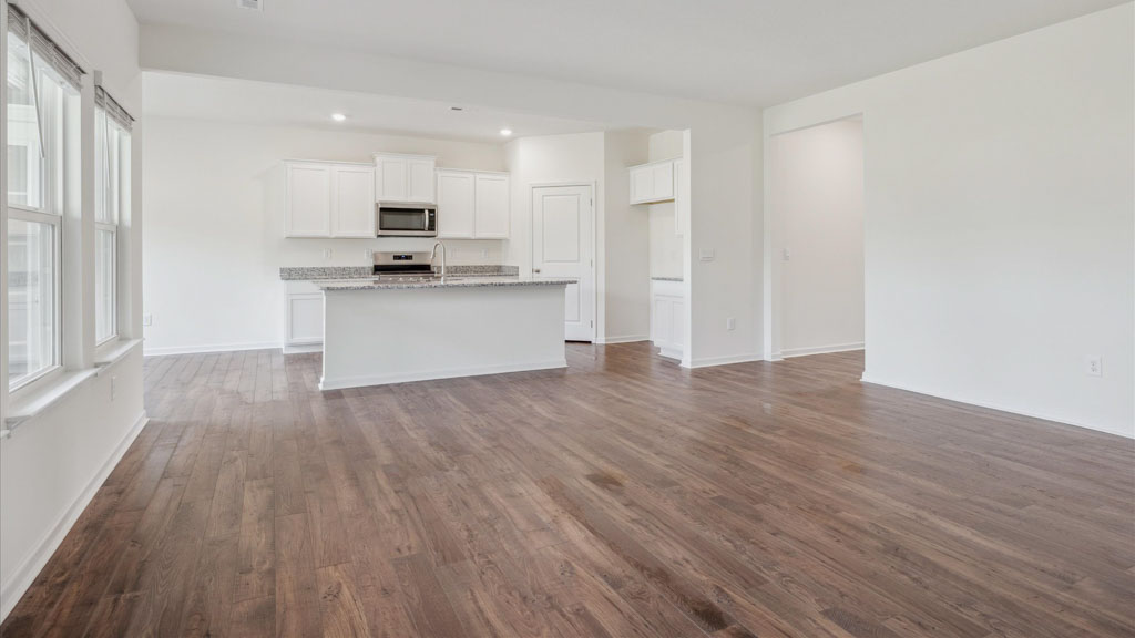 Open concept living, dining, and kitchen space