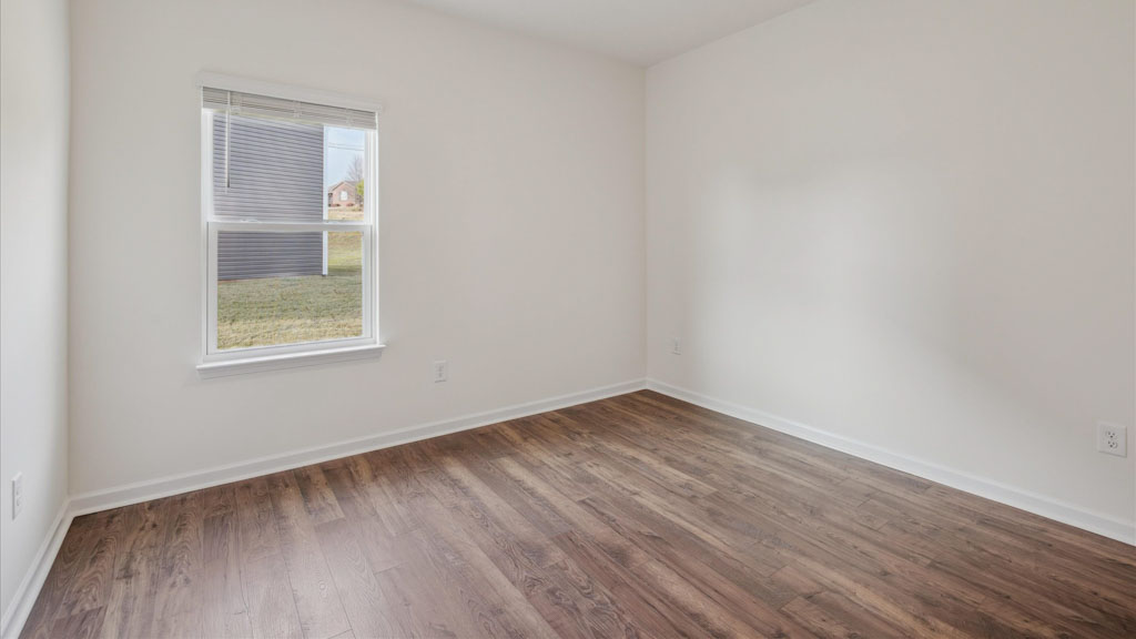 Bedroom with ample natural light and carpet floors